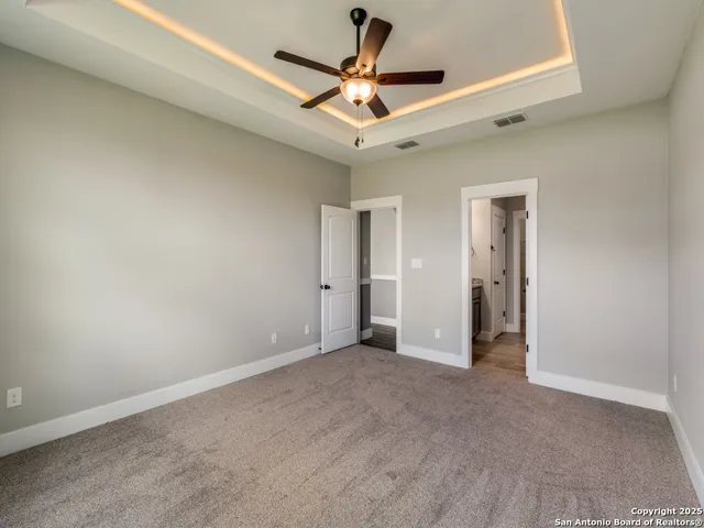 a view of a livingroom with a ceiling fan