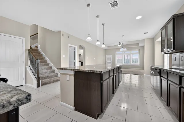 a view of entryway and kitchen