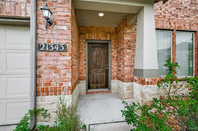 a front view of a building with potted plants