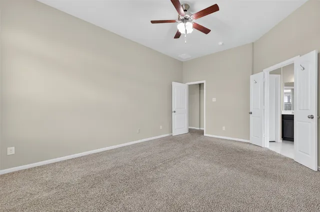 a bathroom with a bathtub a double vanity sink and mirror