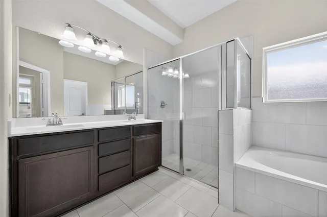 a bathroom with a bathtub and a sink