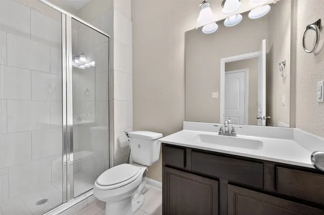 a view of a hallway with wooden floor and entryway