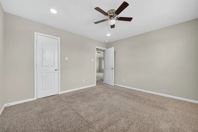 a bathroom with a toilet and a bathtub