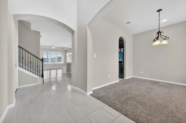a view of a room with wooden floor and windows
