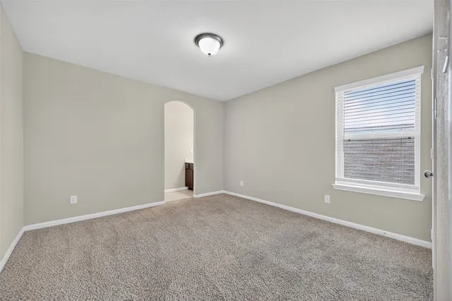 a view of house with backyard