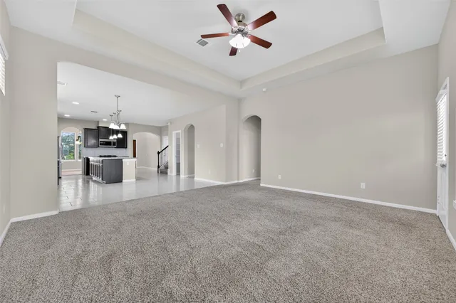 a view of a kitchen with a sink and a refrigerator