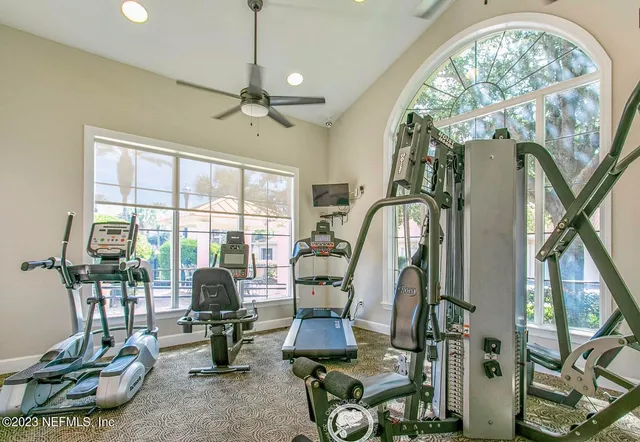 a room with lots of windows and white walls