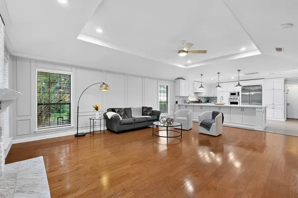 a living room with furniture window and wooden floor