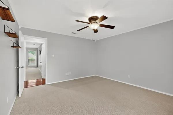 a view of a big room with wooden floor closet and windows