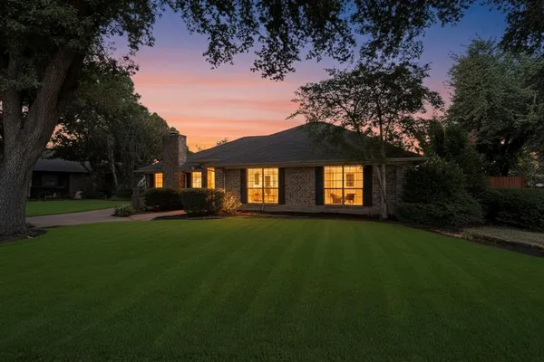 a view of a trees in front of a house