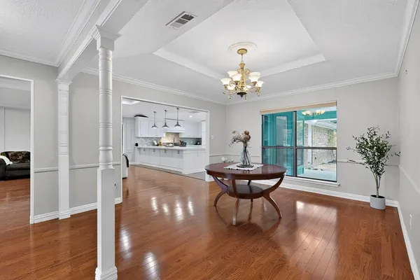 a view of a living room and hardwood floor