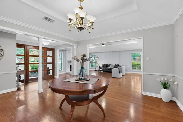 a view of a dining room with furniture window and wooden floor
