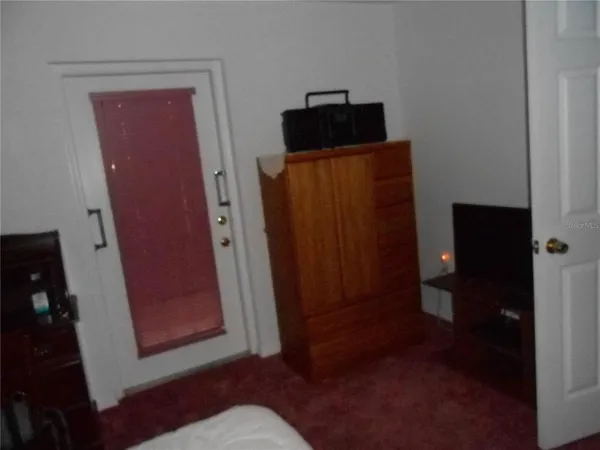 a bedroom with a bed and a table