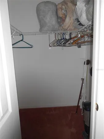a view of storage and utility room with racks on the wall