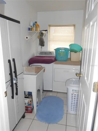 a workspace with furniture and a gate