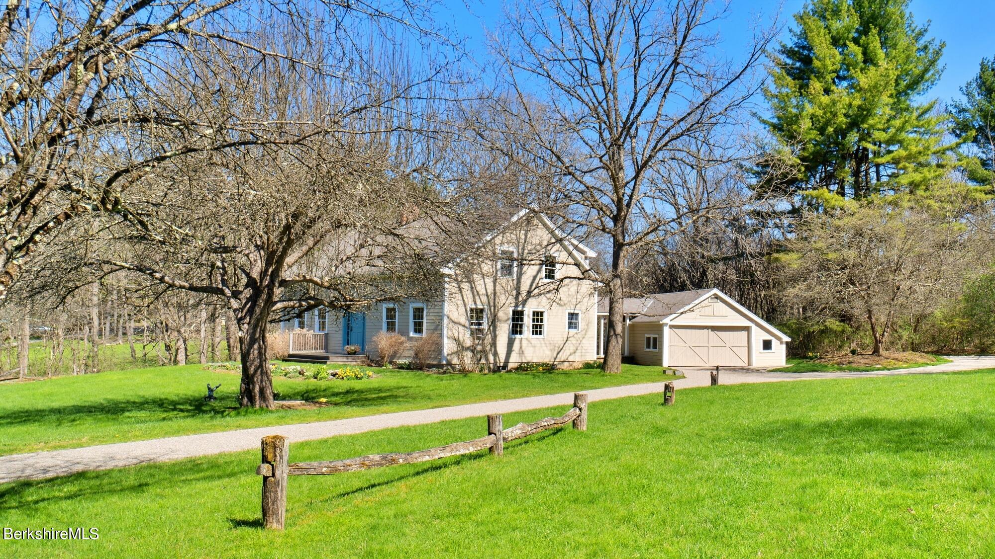 a view of house with a yard