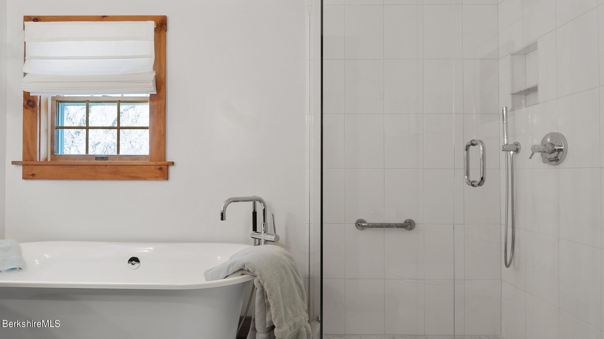 2 Hill Road Stockbridge, MA 01266 - Photo 17 of 24 a bathroom with a white bath tub a shower and a sink