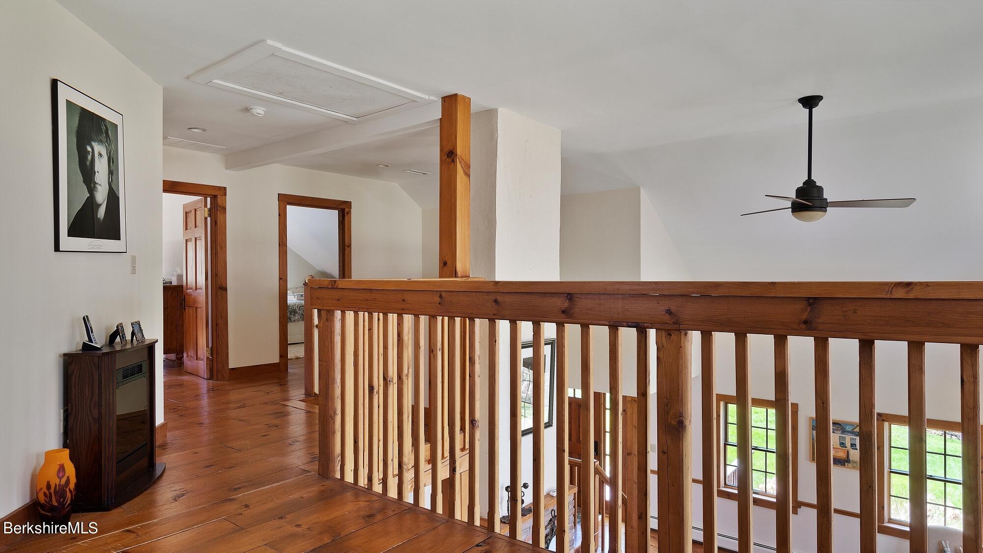 2 Hill Road Stockbridge, MA 01266 - Photo 20 of 24 a view of hallway with wooden floor and stairs