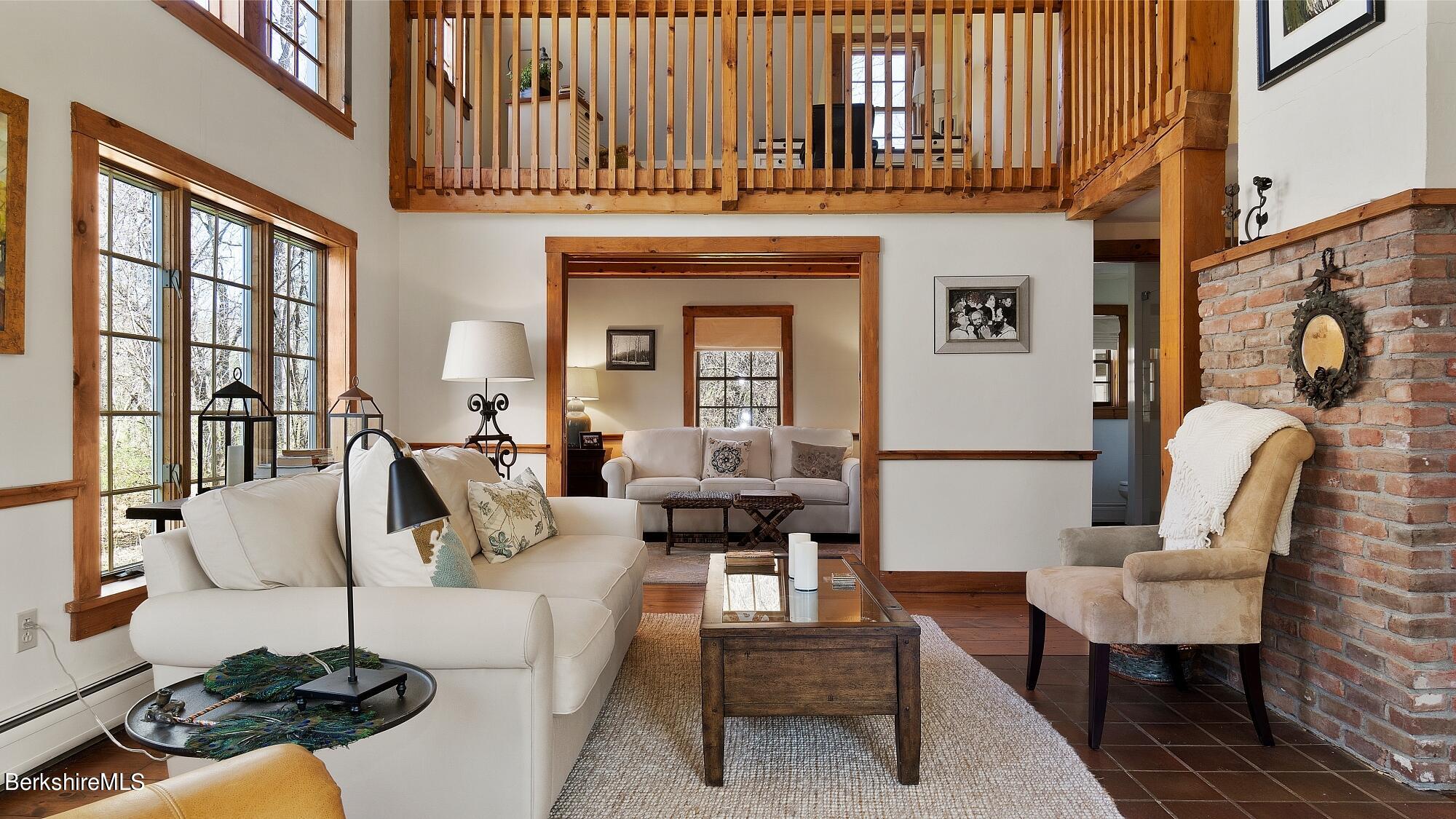 2 Hill Road Stockbridge, MA 01266 - Photo 6 of 24 a living room with furniture a rug and a table