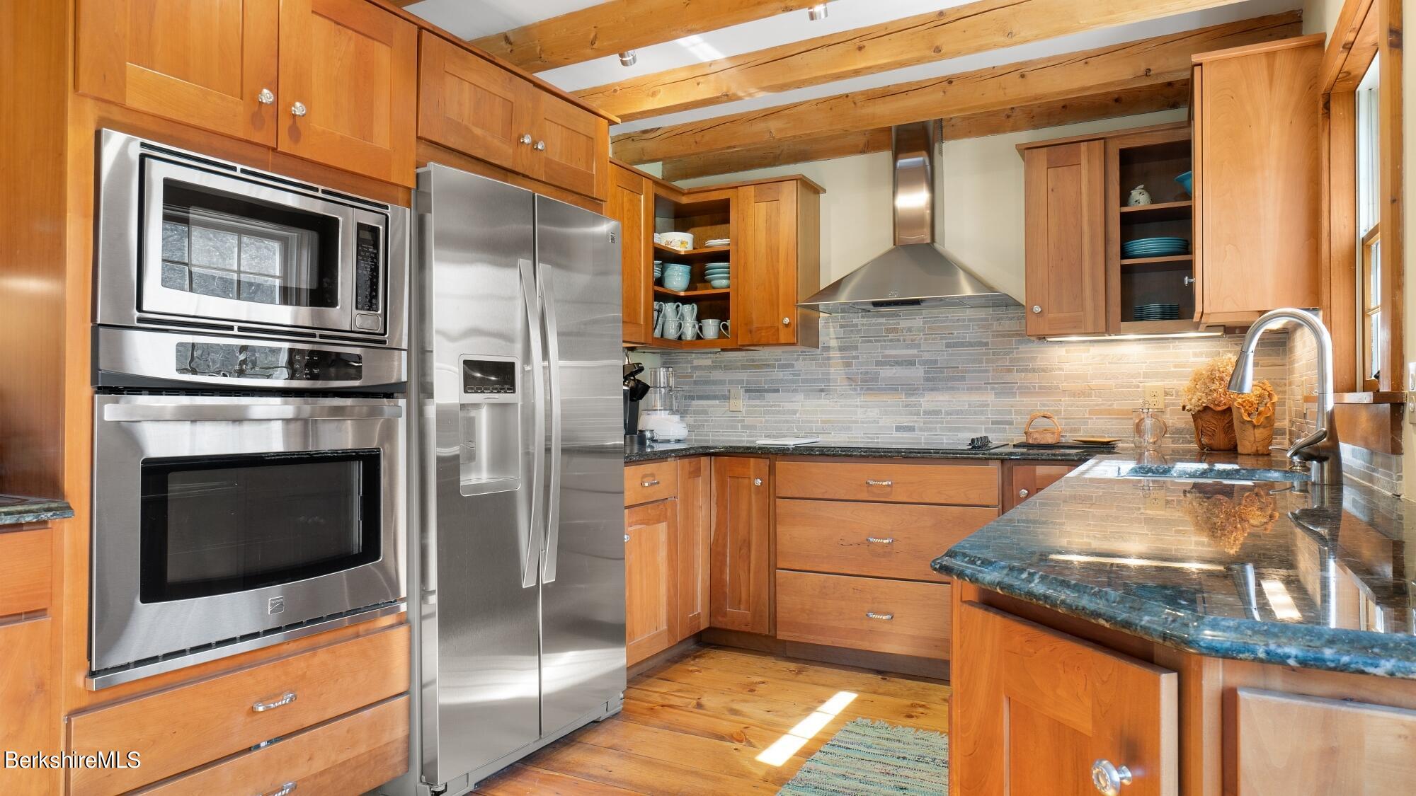 2 Hill Road Stockbridge, MA 01266 - Photo 8 of 24 a kitchen with granite countertop stainless steel appliances and wooden cabinets