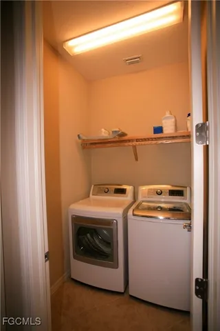 a utility room with dryer and washer