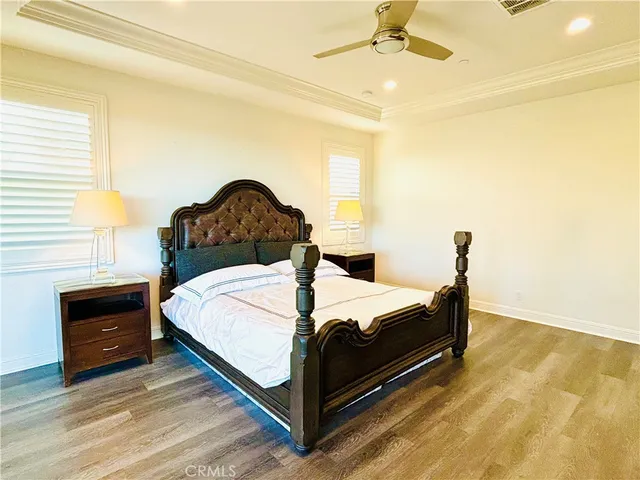 a spacious bedroom with a bed and a couch