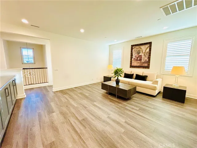 a room with a bed and a mirror