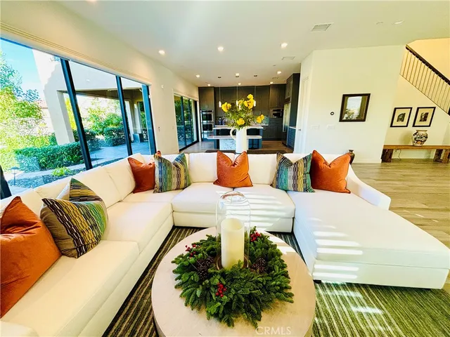 a outdoor living room with furniture and a large window