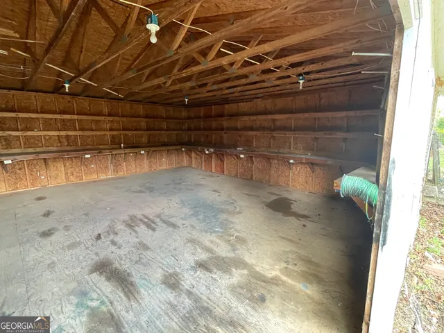 a view of a livingroom with furniture wooden floor and chandelier