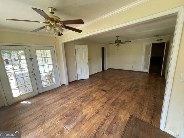 a view of closet area with empty racks