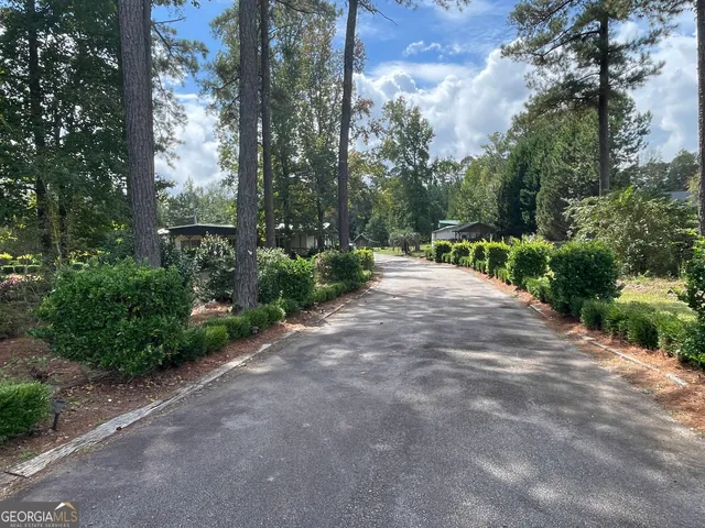 a view of a backyard of the house