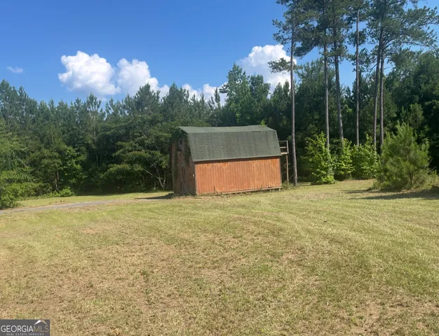 a backyard of a house with lots of green space