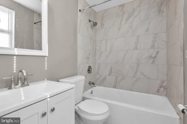 a bathroom with a sink a vanity and a mirror