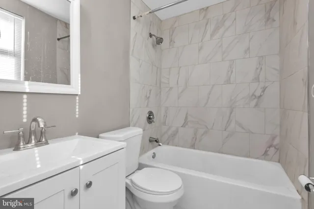 a bathroom with a sink a vanity and a mirror