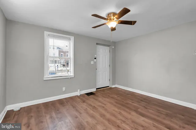 a kitchen with stainless steel appliances granite countertop white cabinets a stove top oven and sink