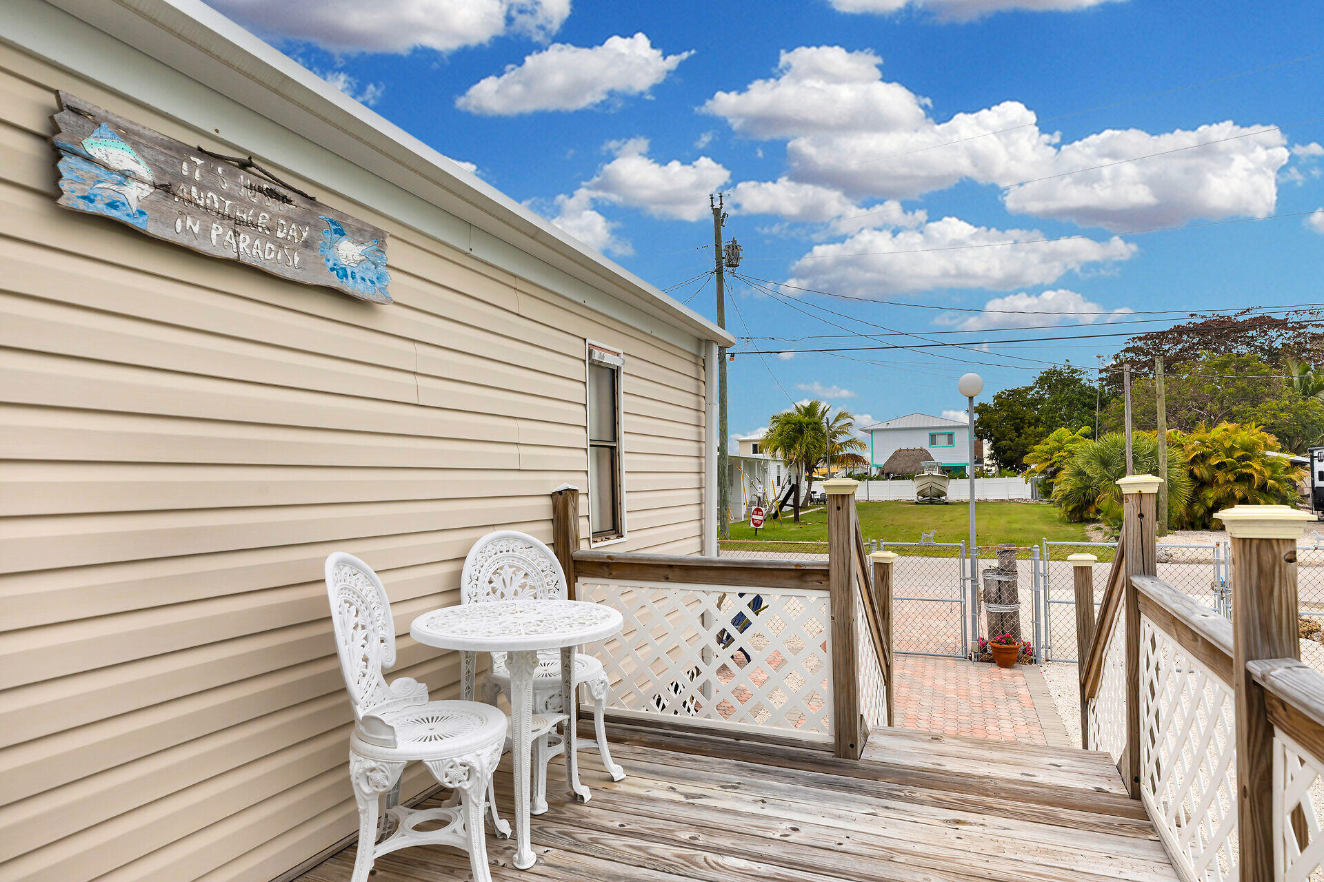 754 Michael Drive Key Largo, FL 33037 - Photo 18 of 23 a view of a chairs and table in the patio