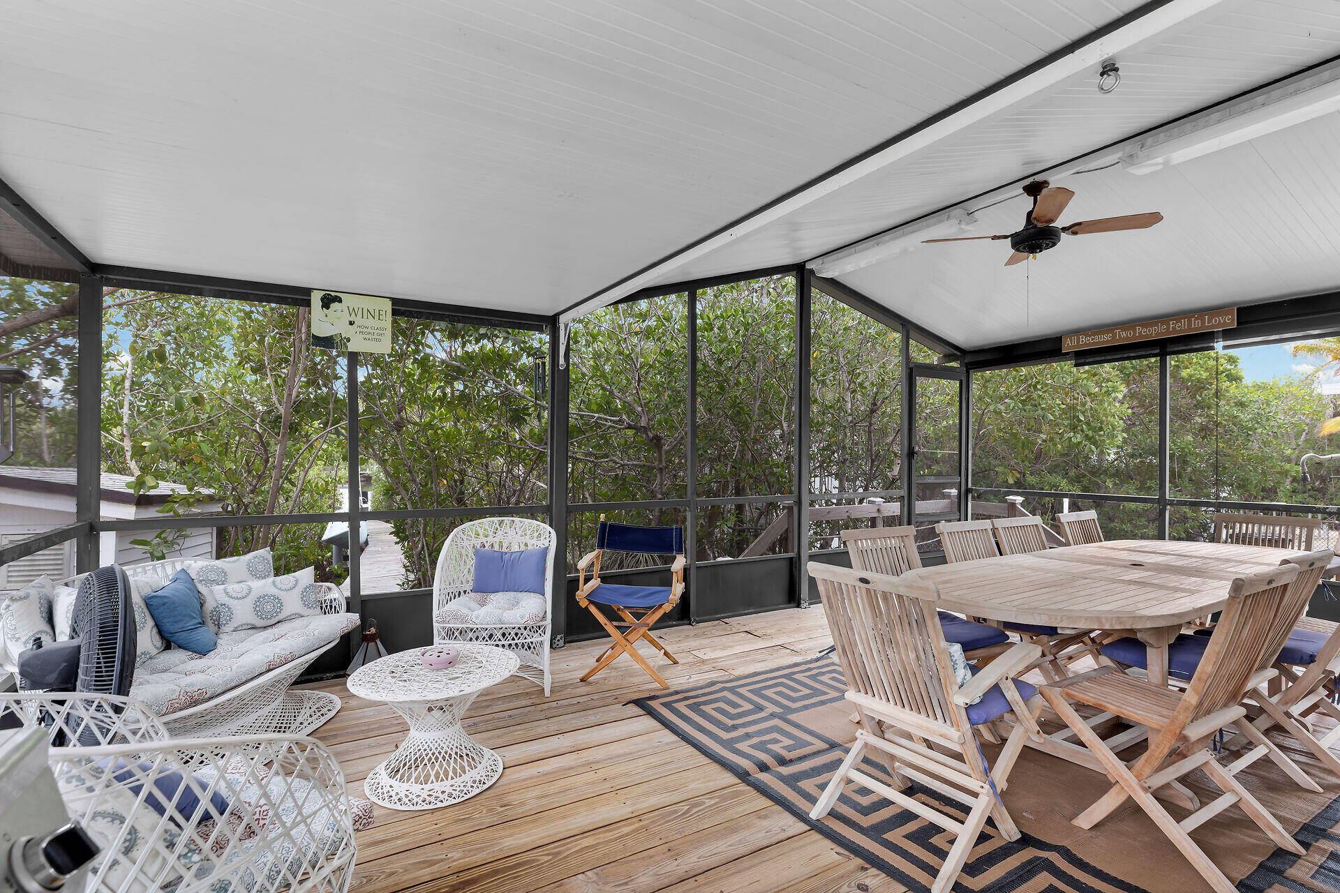 754 Michael Drive Key Largo, FL 33037 - Photo 3 of 23 a dining room with furniture wooden floor and a chandelier