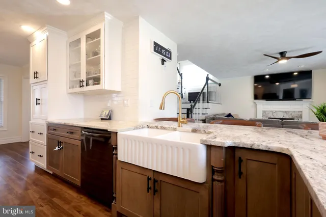 a room with a window and a dresser