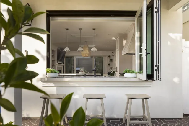 a dining table with chairs and window
