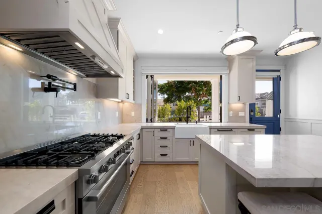 a kitchen with a stove and a sink