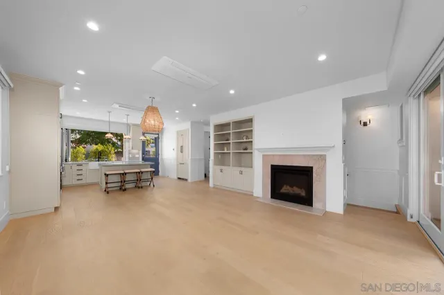 an entryway and livingroom with furniture