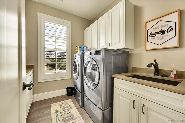 a kitchen with stainless steel appliances granite countertop a sink and a window