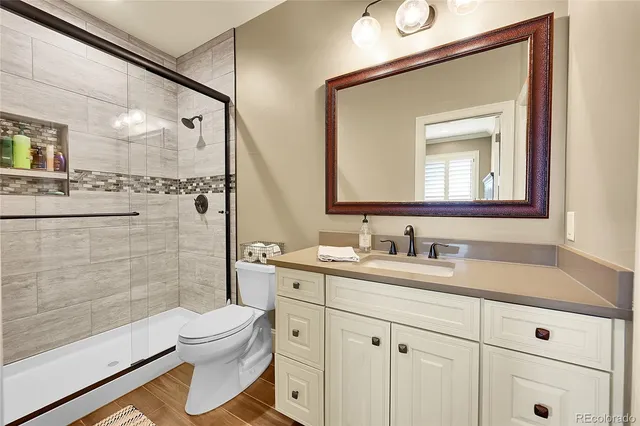 a bed room with a bed and a ceiling fan