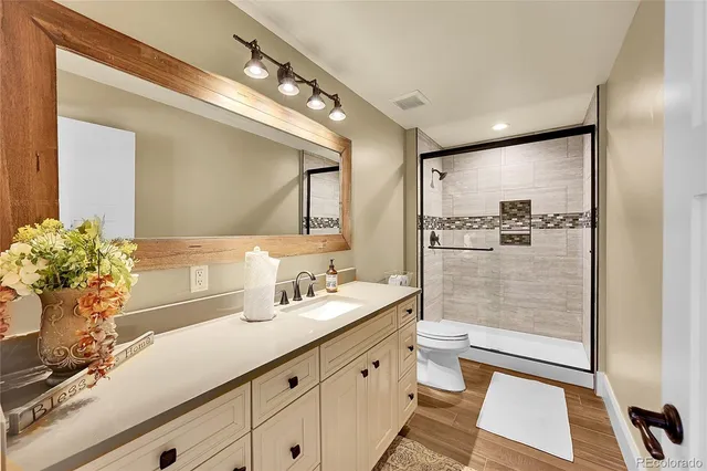 a large bed sitting in a room next to a window