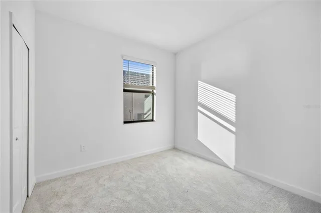 a view of empty room with windows