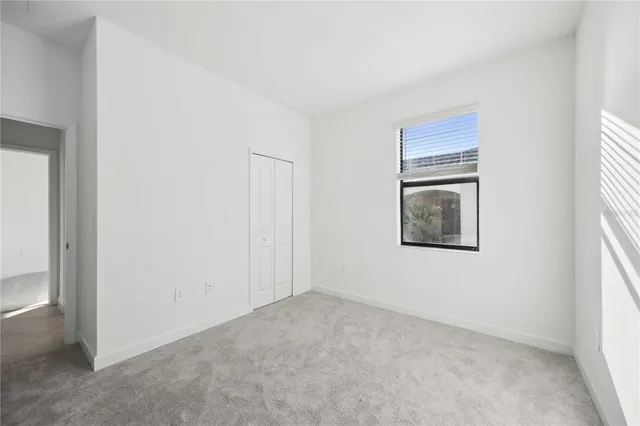 a view of an empty room and window