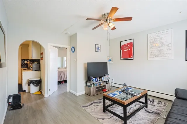 a living room with furniture and a flat screen tv