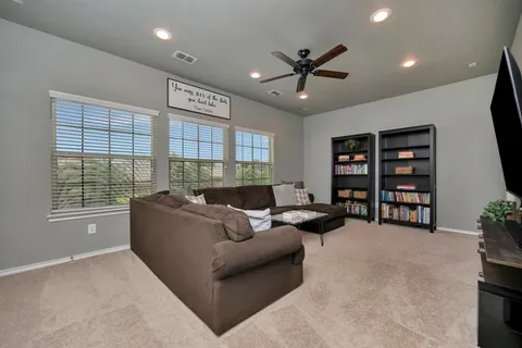 a bedroom with a bed and a chair