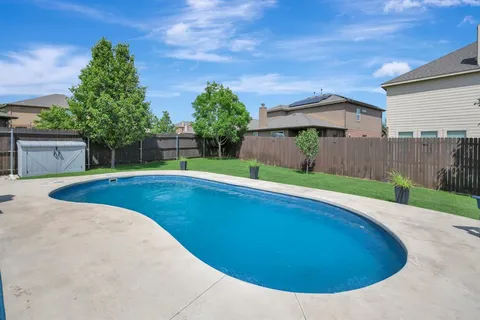 a view of a house with a yard porch and sitting area