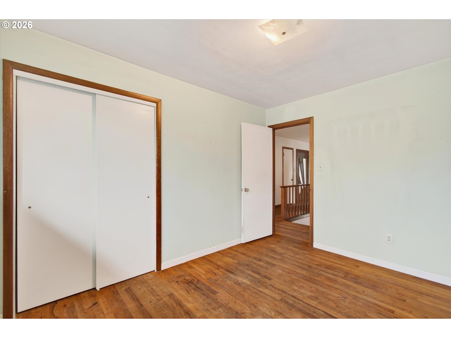 919 Cascade Drive Longview, WA 98632 - Photo 14 of 33 a view of an empty room with wooden floor